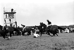 The Grand National at Aintree: Jockey A. Webber has just fallen off Bally Richard again The Grand National at Aintree: Jockey A. Webber has just fallen off Bally Richard again