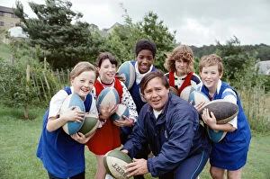 Images Dated 9th July 1990: Great fun, this rugby lark... at least that is the impression given by these youngsters