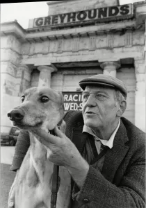Greyhound trainer with his dog No Stranger at the last meeting at the Derby Greyhound Greyhound trainer with his dog No Stranger at the last meeting at the Derby Greyhound