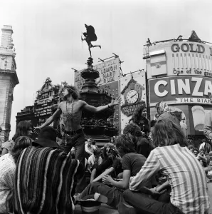 A group of hippies in Piccadilly Circus, London. 15th August 1969 A group of hippies in Piccadilly Circus, London. 15th August 1969