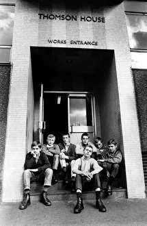 A group of skinheads sitting on the steps of Thomson House, works entrance A group of skinheads sitting on the steps of Thomson House, works entrance