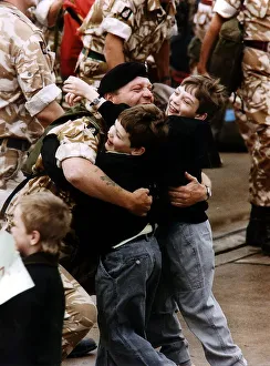 Gulf War reunion A soldier is met by his two children returning from Gulf War Gulf War reunion A soldier is met by his two children returning from Gulf War