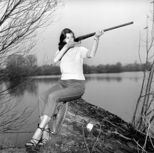 Gwendolen Tulley poses with her rifle as she enjoys a shooting holiday, 1956 Gwendolen Tulley poses with her rifle as she enjoys a shooting holiday, 1956