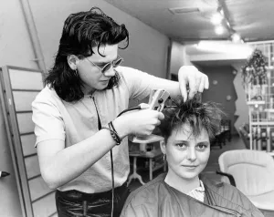 A hair dresser putting hair extensions in model Lisa Houghtons hair in July 1986 A hair dresser putting hair extensions in model Lisa Houghtons hair in July 1986