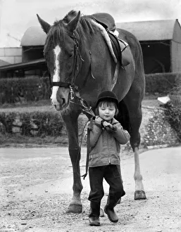 Two and a half year old Julie Bainbridge has made up her mind to ride in the grand Two and a half year old Julie Bainbridge has made up her mind to ride in the grand