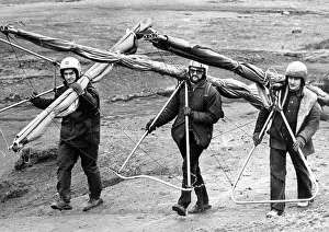 These hang gliders have a long hard trek back up the hill to start again in March 1975 These hang gliders have a long hard trek back up the hill to start again in March 1975