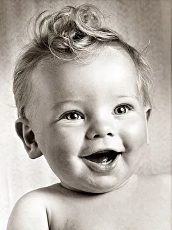 Happy baby boy with a stylish haircut. Circa 1950 Happy baby boy with a stylish haircut. Circa 1950