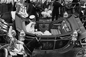 The happy couple left St Paul's Cathedral in an open topped carriage happily waving The happy couple left St Paul's Cathedral in an open topped carriage happily waving
