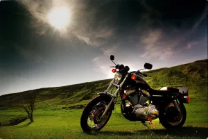 Harley Davidson motorbike sitting in field June 1998 sun shining dark skies Harley Davidson motorbike sitting in field June 1998 sun shining dark skies