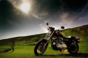 Harley Davidson motorbike sitting in field June 1998 sun shining dark skies Harley Davidson motorbike sitting in field June 1998 sun shining dark skies