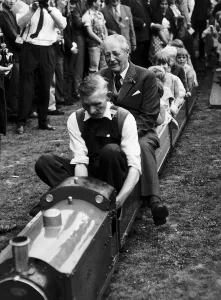 Harold MacMillan Tory Prime Minister enjoys a ride on the minature railway during his Harold MacMillan Tory Prime Minister enjoys a ride on the minature railway during his