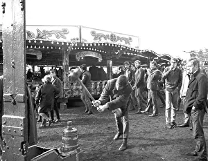 Hearsall Common Easter fair, Coventry. Youths have a go at ringing the bell at Hearsall Common Easter fair, Coventry. Youths have a go at ringing the bell at
