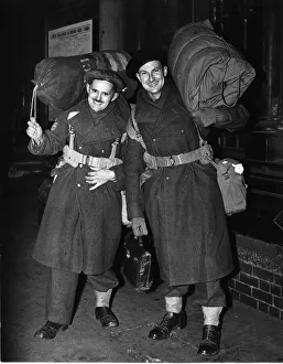 Two heavily laden soldiers of the British Army, Sergeants Lester (left) and Jarvis Two heavily laden soldiers of the British Army, Sergeants Lester (left) and Jarvis