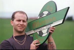 Hibs casual fan Andy Blance from Fife October 1993 holding Hibernian sign member of Hibs casual fan Andy Blance from Fife October 1993 holding Hibernian sign member of