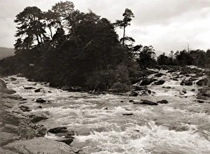 A Highland river in full flow, after the snow has melted from the high mountains in A Highland river in full flow, after the snow has melted from the high mountains in