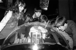 Holiday makers looking at the moon rock from Apollo II's moon landing Holiday makers looking at the moon rock from Apollo II's moon landing