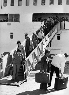 These holidaymakers look unhappy that their holiday is over These holidaymakers look unhappy that their holiday is over