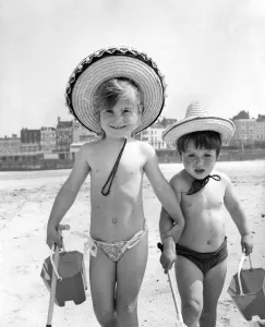 Holidays children: On the beach at Margate, Kent complete with buckets Holidays children: On the beach at Margate, Kent complete with buckets