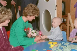 HRH Princess Diana, The Princess of Wales, receives flowers from 3 year old Philip Lott HRH Princess Diana, The Princess of Wales, receives flowers from 3 year old Philip Lott