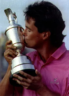 Ian Baker Finch Australian Golfer holding and kissing golf trophy Ian Baker Finch Australian Golfer holding and kissing golf trophy