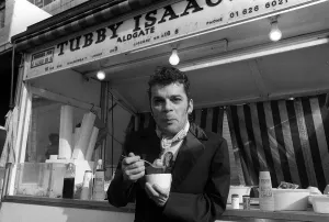Ian Dury outside the East End stall of Tubby Isaacs eating bowl of Jellied eels Ian Dury outside the East End stall of Tubby Isaacs eating bowl of Jellied eels