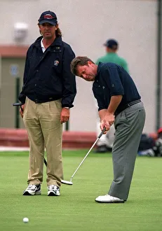 Ian Woosnam practices his putting watched by Caddie, Wobbly Ian Woosnam practices his putting watched by Caddie, Wobbly