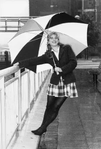 Imogen Stubbs Actress holding up Umbrella and leaning back while holding on to railing Imogen Stubbs Actress holding up Umbrella and leaning back while holding on to railing