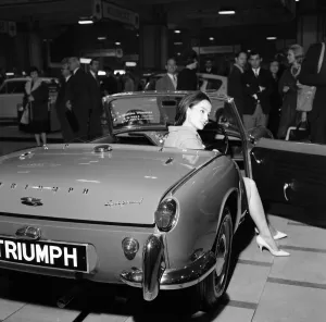 Indonesian model Mai Ling with the new Triumph Spitfire 4 at the Earls Court Motor show Indonesian model Mai Ling with the new Triumph Spitfire 4 at the Earls Court Motor show