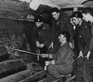An instructor at the Government pit school showing Bevin Boys how to follow a seam of An instructor at the Government pit school showing Bevin Boys how to follow a seam of