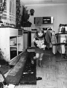 Interior view of a London terraced house showing a child in the kitchen March 1983 Interior view of a London terraced house showing a child in the kitchen March 1983
