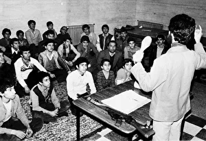 Iran boys and men being in instructed by military teacher. 1979 Iran boys and men being in instructed by military teacher. 1979