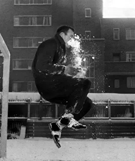 Jack Kelsey Football Player of Arsenal - January 1961 gets a face full of snow as Jack Kelsey Football Player of Arsenal - January 1961 gets a face full of snow as
