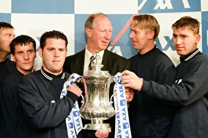 Jackie Charlton and the Ashington football team with the AXA FA Cup Jackie Charlton and the Ashington football team with the AXA FA Cup