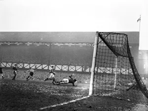 Jackie Milburn of Newcastle United scores a goal against Portsmouth. FA Cup Quarter-final Jackie Milburn of Newcastle United scores a goal against Portsmouth. FA Cup Quarter-final