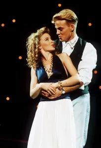Jason Donovan actor singer arms round Kylie Minogue Jason Donovan actor singer arms round Kylie Minogue