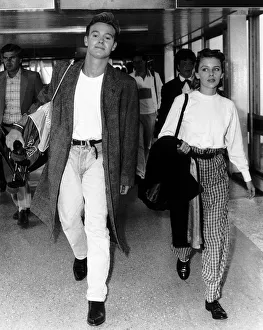 Jason Donovan actor singer with Kylie Minogue actress singer walk through airport Jason Donovan actor singer with Kylie Minogue actress singer walk through airport