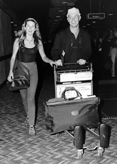 Jason Donovan Actor and Singer leaving Heathrow with gfirlfriend Tara Owen for the far Jason Donovan Actor and Singer leaving Heathrow with gfirlfriend Tara Owen for the far