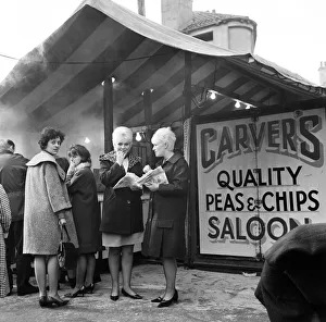 Jeanne Stather (22) and Jennifer Fussey (19) enjoy lunch time chips from the open air Jeanne Stather (22) and Jennifer Fussey (19) enjoy lunch time chips from the open air