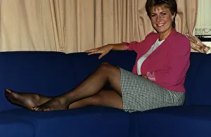 Jill Dando TV Presenter sitting with legs up on sofa on BBC Breakfast time Jill Dando TV Presenter sitting with legs up on sofa on BBC Breakfast time