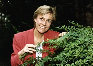 Jill Dando TV Presenter standing behind a bush Jill Dando TV Presenter standing behind a bush