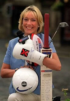 Images Dated 3rd June 1999: Jill Douglas TV Presenter 1999 who has joined Sky TV holding bat ball golf club