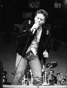 Jim Kerr, lead singer of the rock group Simple Minds entertains the crowd at the groups Jim Kerr, lead singer of the rock group Simple Minds entertains the crowd at the groups