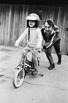 Jimmy Greaves pushing his 4-year old son Andrew, wearing his fathers crash helmet Jimmy Greaves pushing his 4-year old son Andrew, wearing his fathers crash helmet
