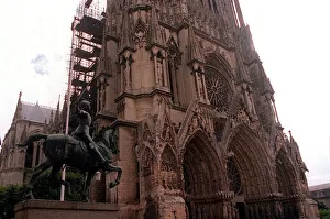 Joan of Arc statue looking up at the Cathedral at Reims Rheims France Joan of Arc statue looking up at the Cathedral at Reims Rheims France
