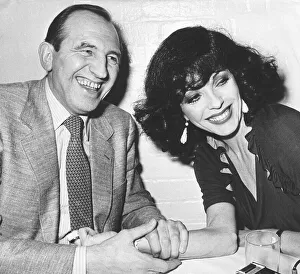 Joan Collins actress with actor Leonard Rossiter during dinner at The Neal Street Joan Collins actress with actor Leonard Rossiter during dinner at The Neal Street