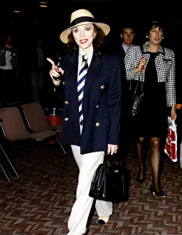 Joan Collins Actress Walking throuh Airport holding black bag Joan Collins Actress Walking throuh Airport holding black bag