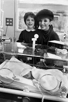 Images Dated 1st December 1980: Joan Collins and daughter Katya in intensive care unit in Central Middlesex Hospital