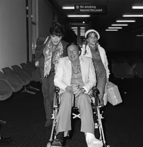 Joan Collins with husband Ron Kass and daughter Katyana arriving at Heathrow from Los Joan Collins with husband Ron Kass and daughter Katyana arriving at Heathrow from Los