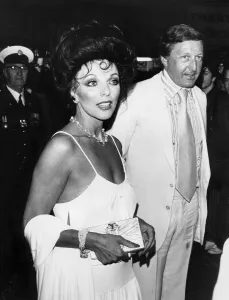 Joan Collins and husband Ron Kass at premiere of The Stud - April 1978 Joan Collins and husband Ron Kass at premiere of The Stud - April 1978