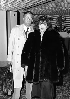 Joan Collins and Roger Moore at Heathrow airport, July 1988 Joan Collins and Roger Moore at Heathrow airport, July 1988
